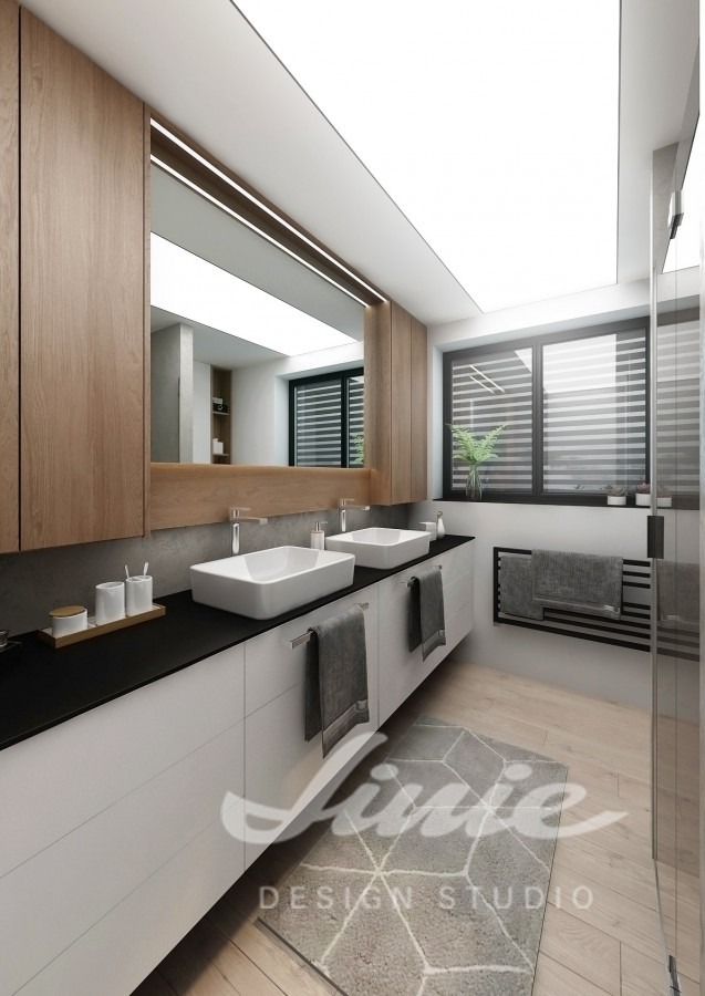 Moderní koupelna s černobílými prvky a skříňkami z tmavého dřeva