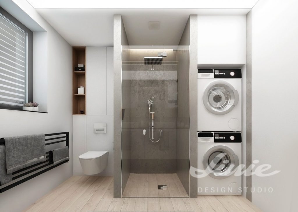 Moderní koupelna s proskleným sprchovým koutem spojena s prádelnou a toaletou