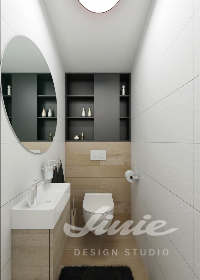 Moderní koupelna s černým úložným prostorem toaleta
